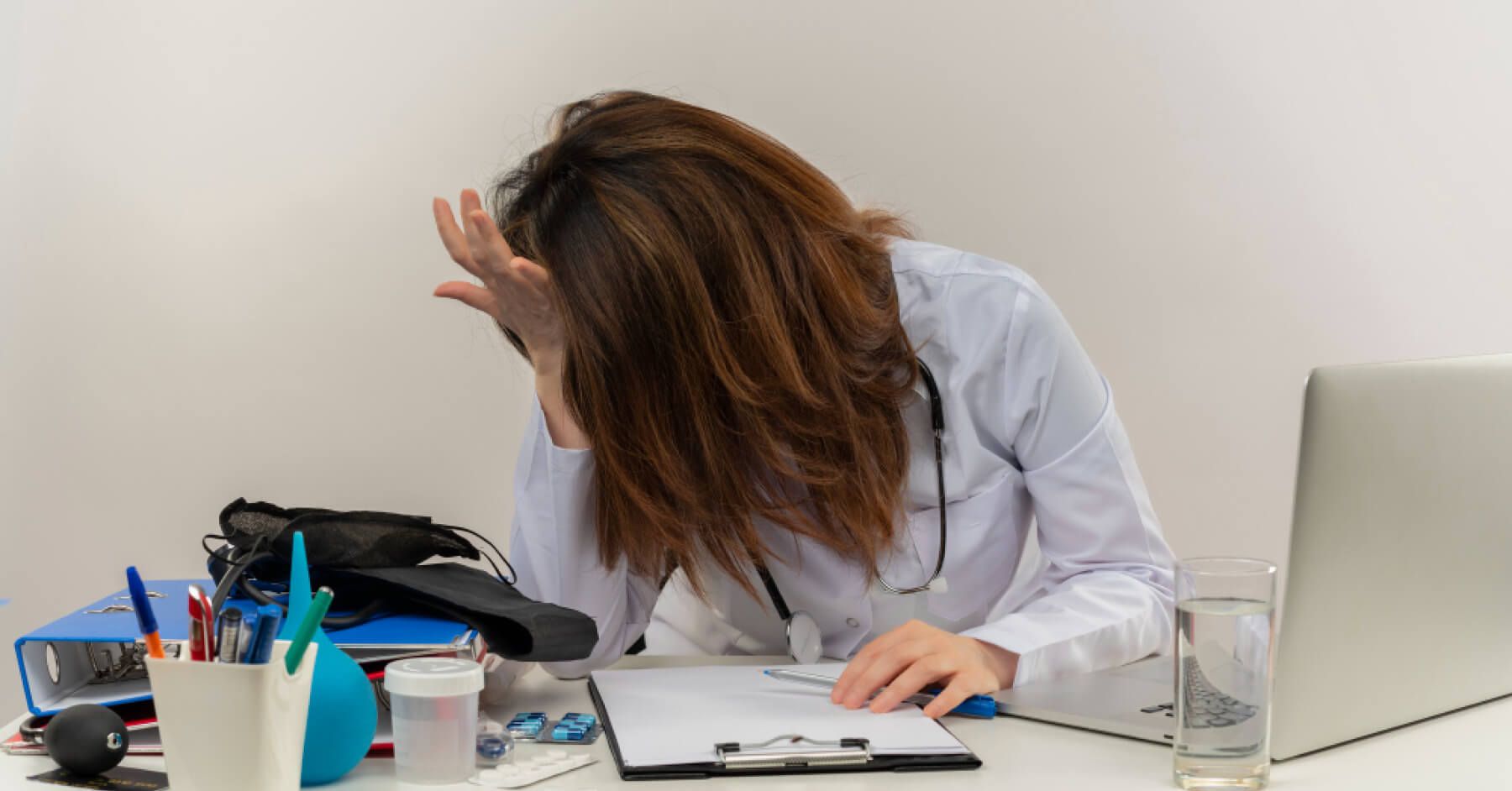 Burnt out employee in front of a laptop
