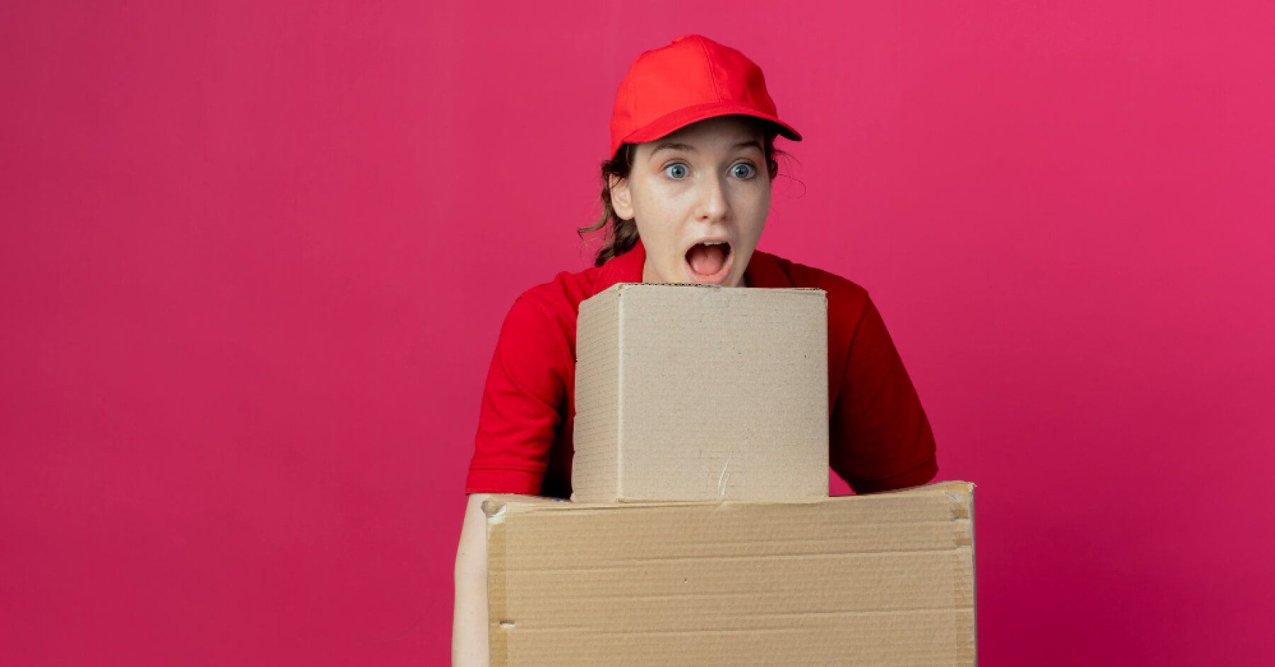 Logistics employee with a stack of boxes