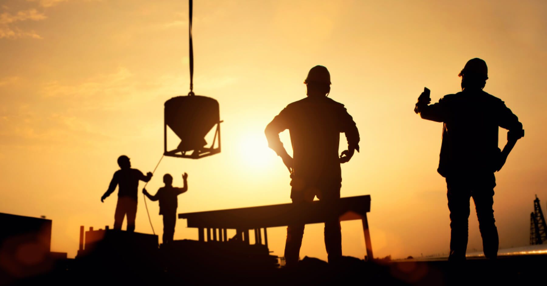 Silhouette of people in a construction site