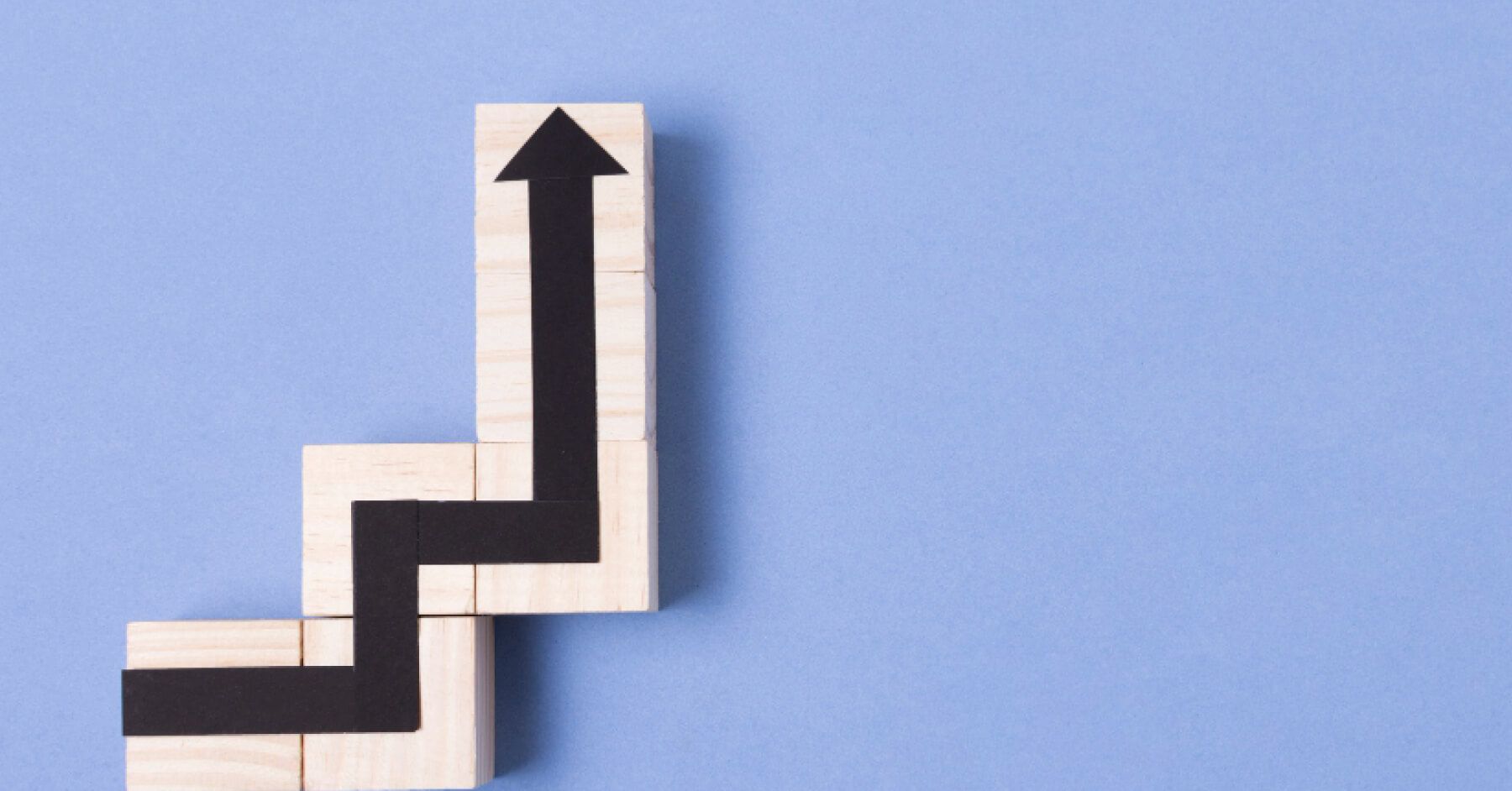 An arrow against a purple background that leads up