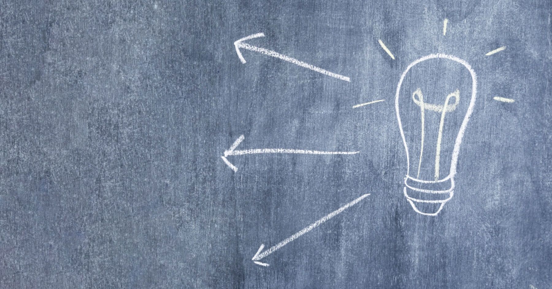 Chalk drawing of a bulb against a black board