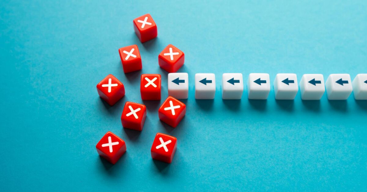 Plastic arrow blocks disrupted by red X blocks