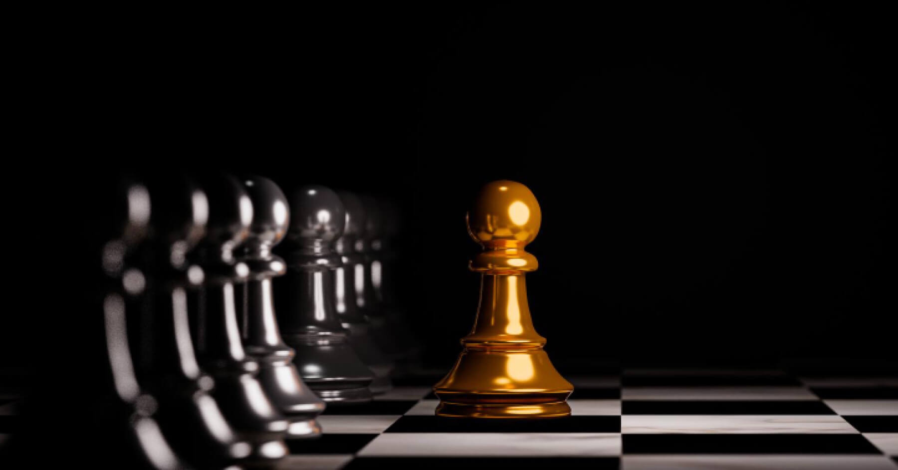 White chess pawn coming through a line of black chess pawn on a chess board