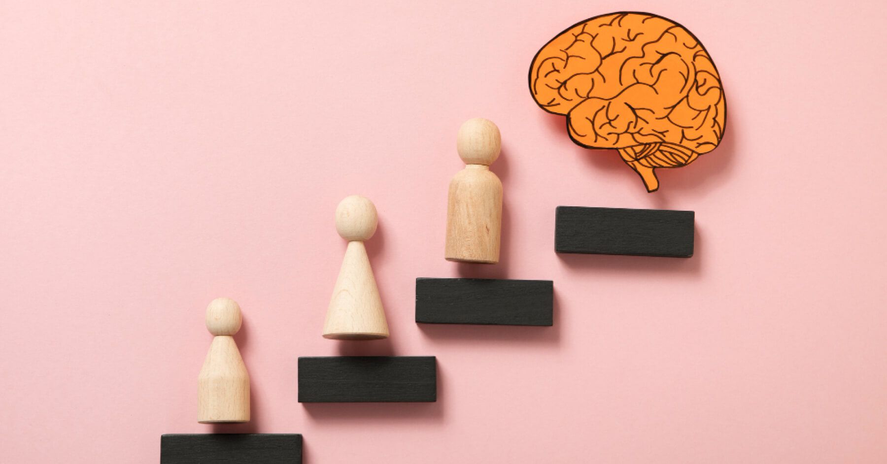 Steps filled with wooden pawns that lead to a brain