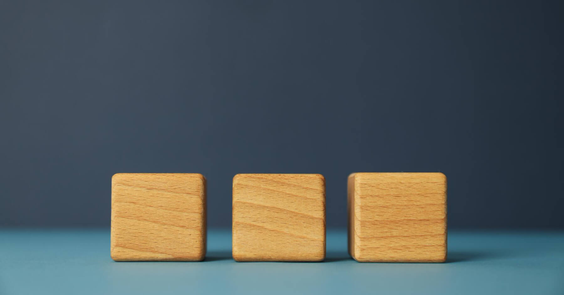 Three wooden blocks placed next to each other
