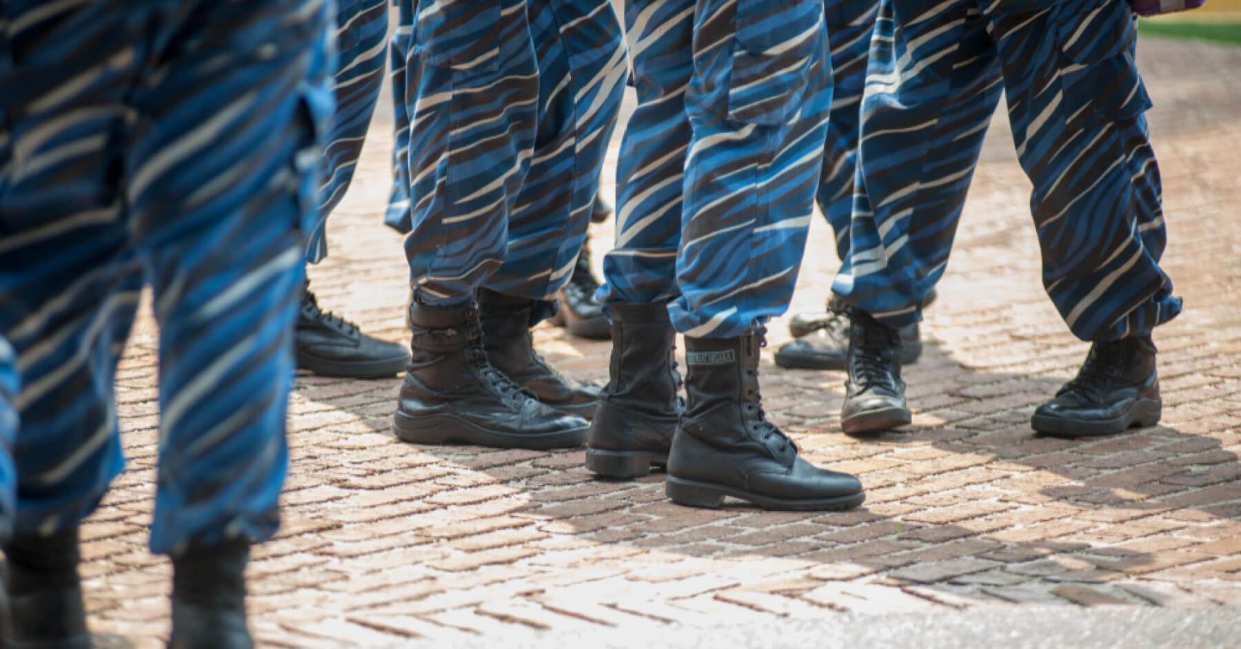 Feet of soldiers in army uniform