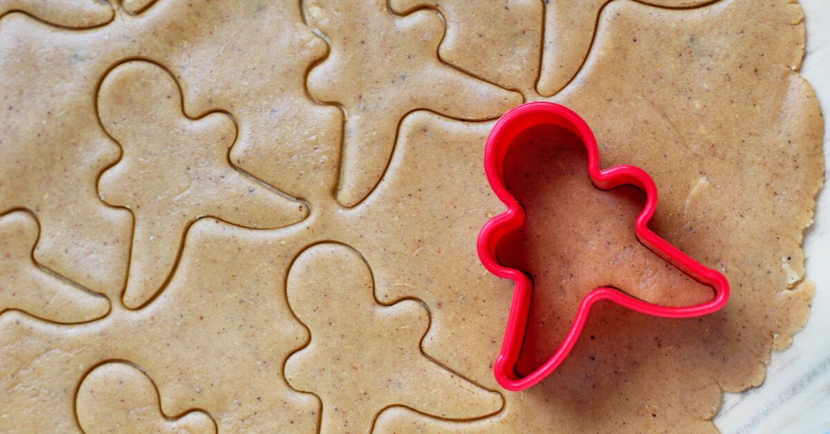Cookie cutter shape being used on a cookie dough