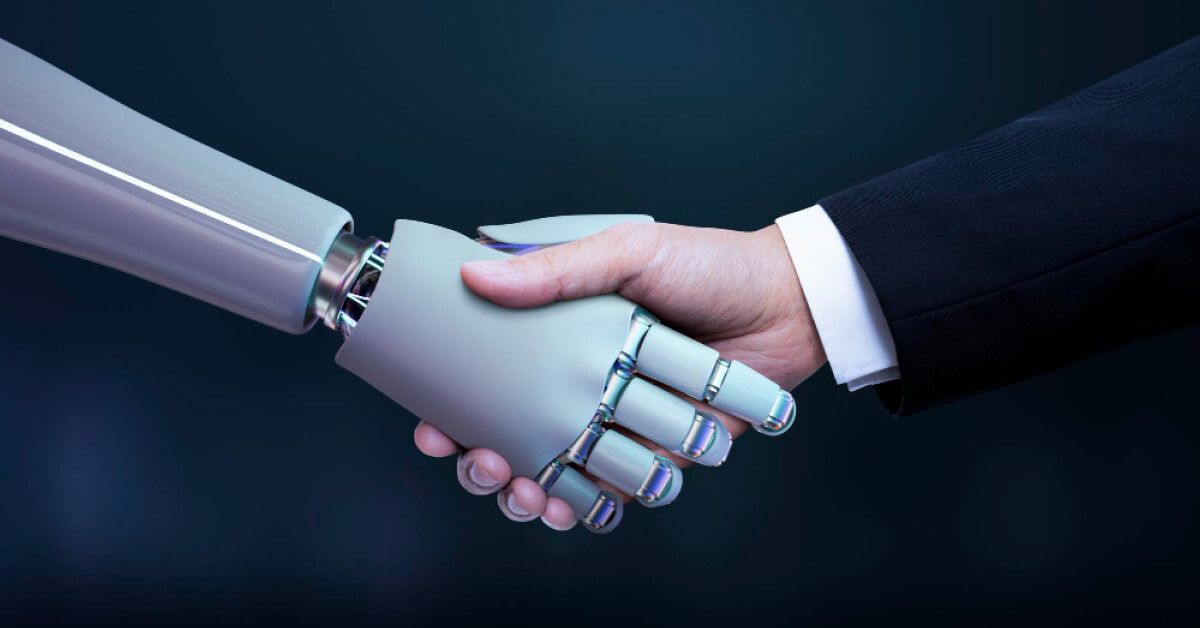 Human hand shaking a robot hand