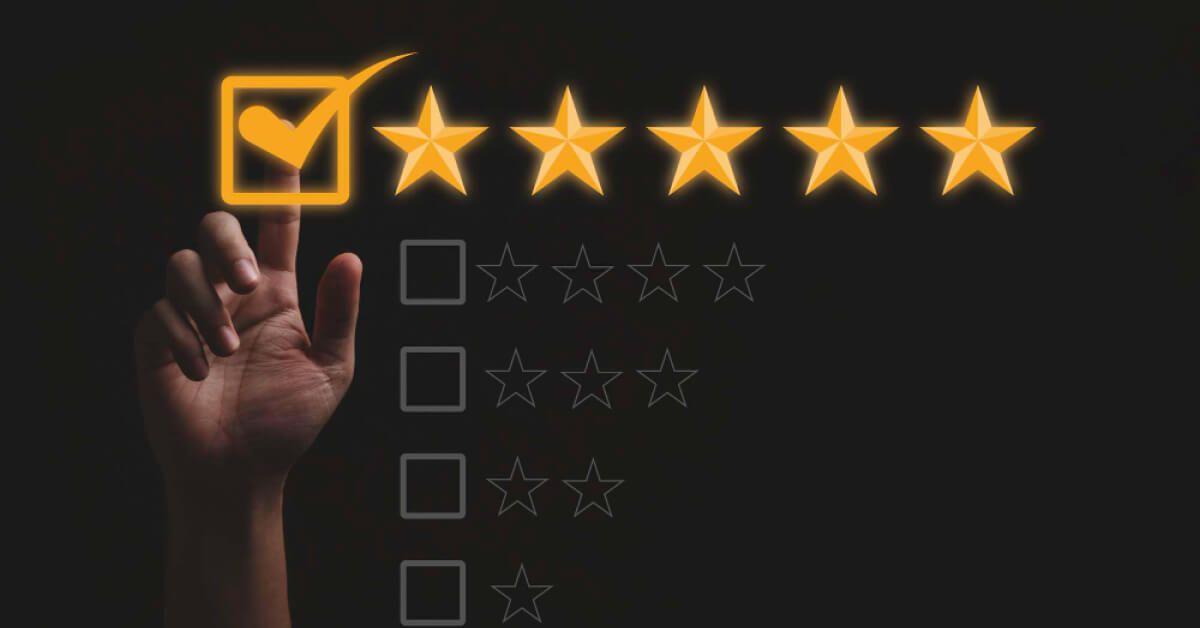 Hands taking a survey and rating stars
