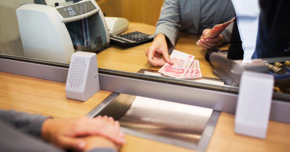 person at a banking counter 