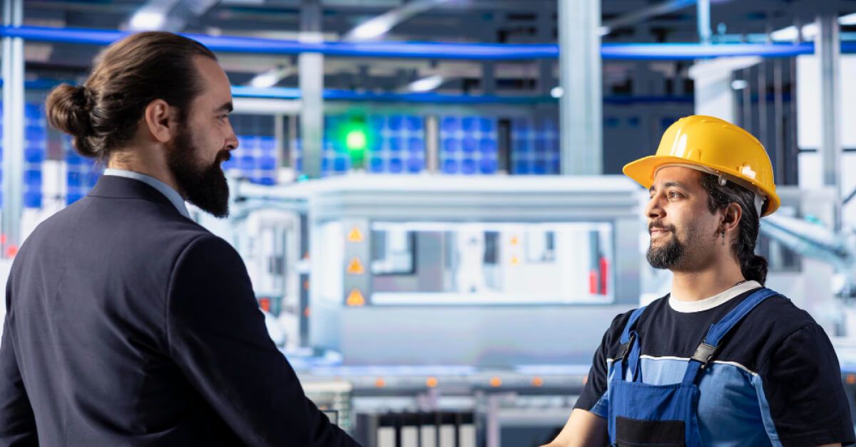 Manufacturing worker shaking hands with a HR