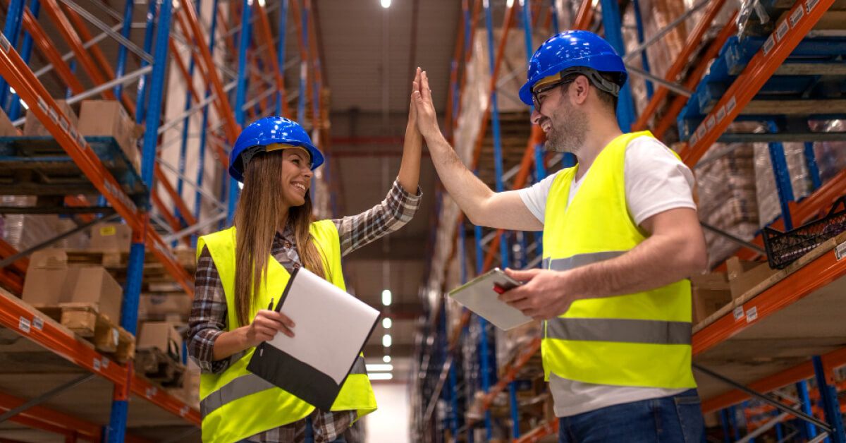 workers high-fiving each other