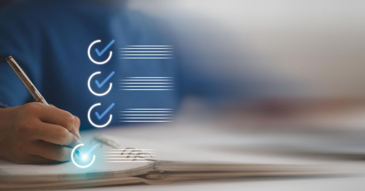 A hand ticking off a checklist