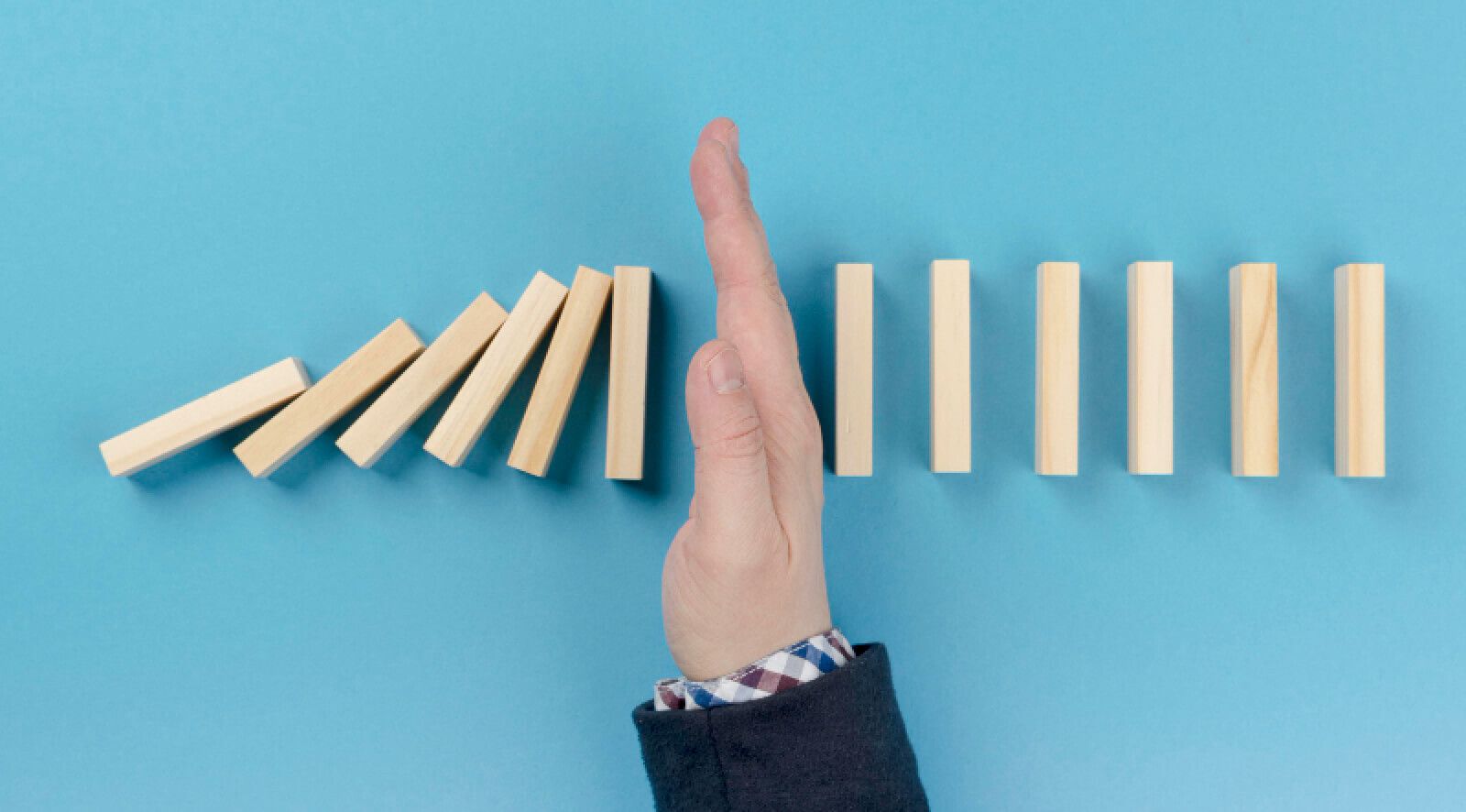 hand blocking blocks falling down.