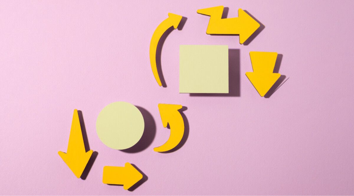 Abstract wooden images of arrows, circle and a square