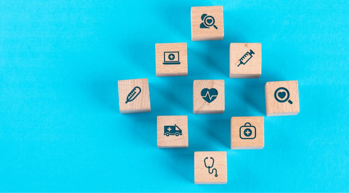 Wooden blocks of healthcare challenges