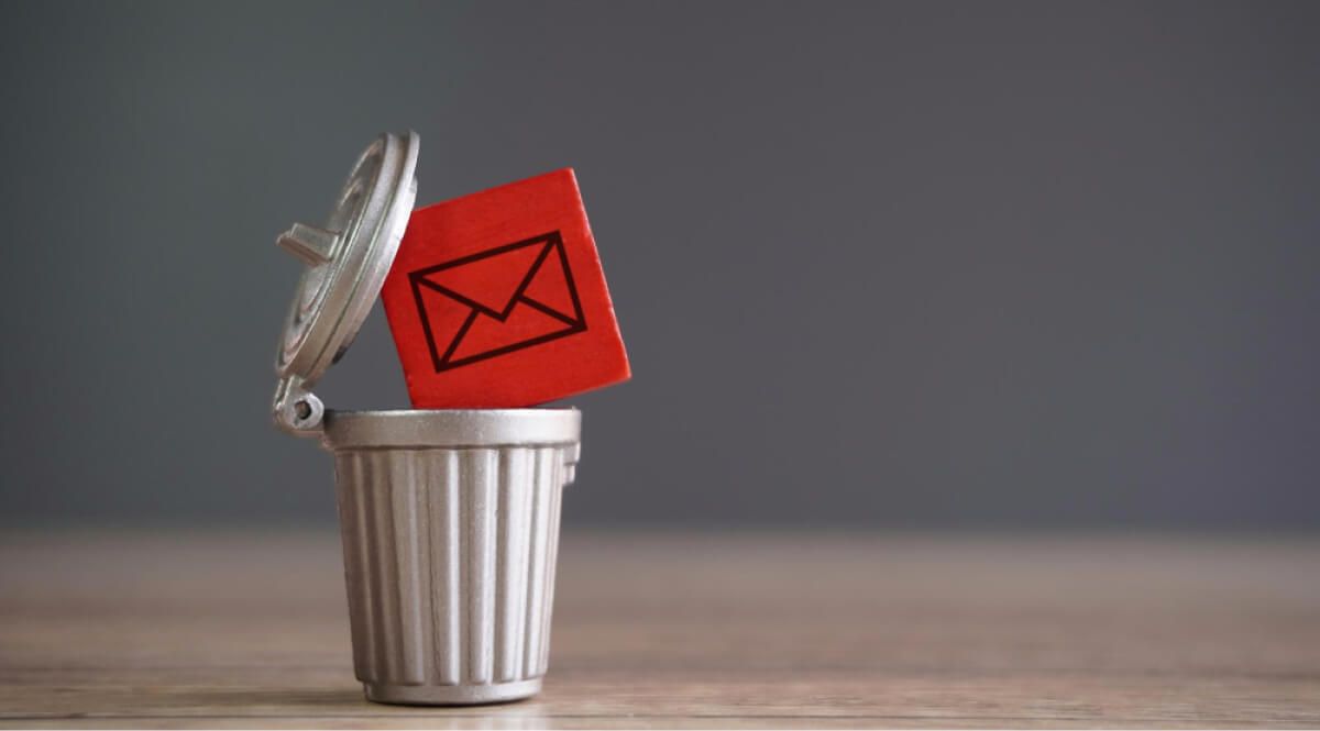 Mockup of a trashcan holding an email wooden block