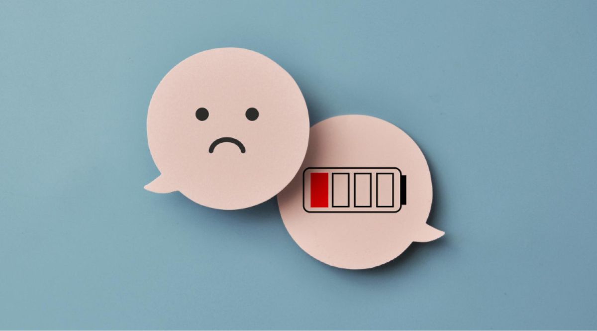 Wooden clouds of a sad emoji and a low battery