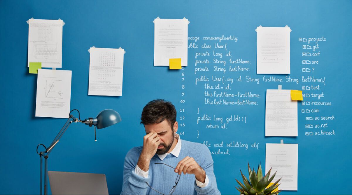 a man with his hand on his face, disappointed 