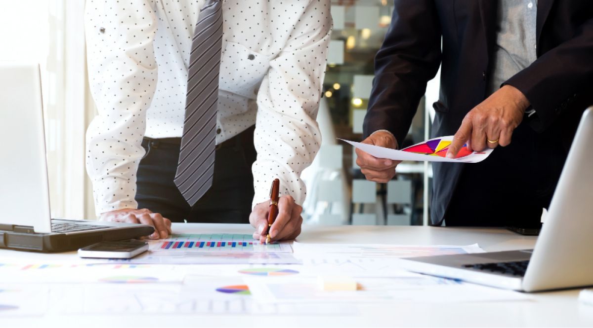 Consultants looking at charts