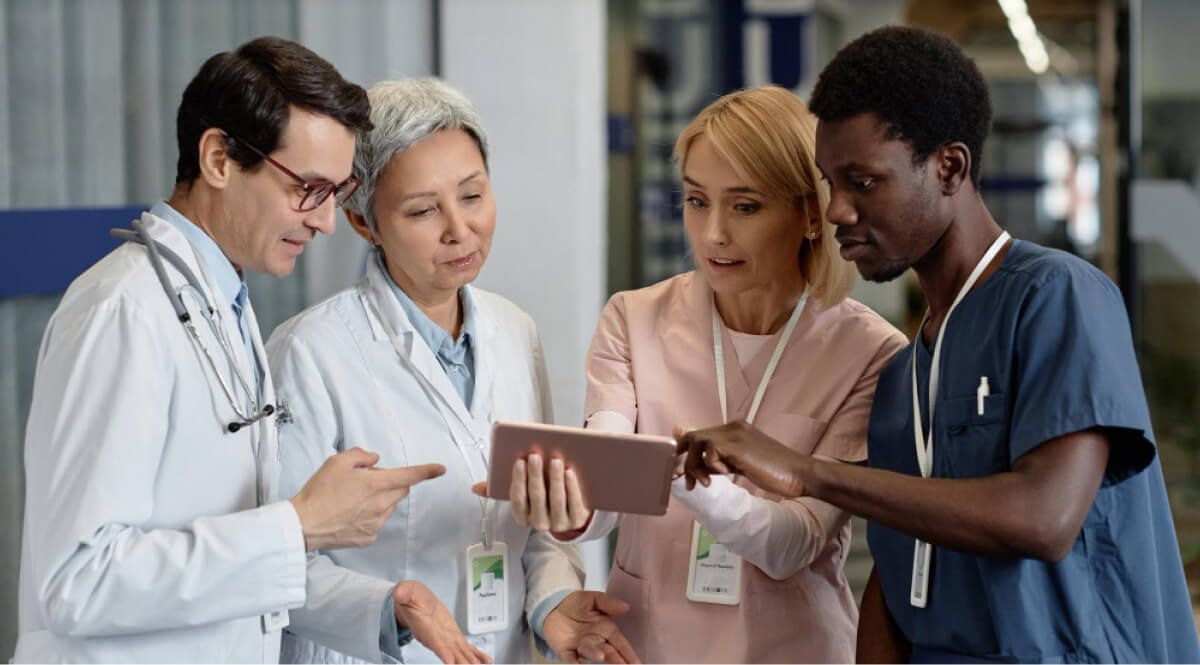 Healthcare workers discussing together