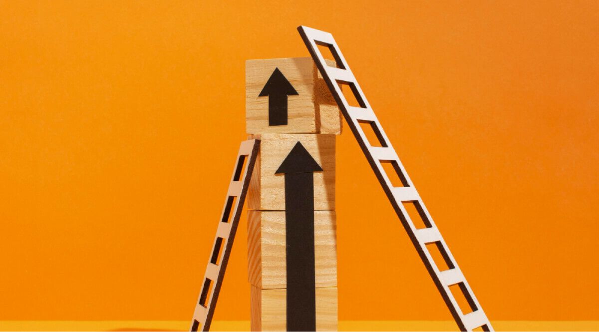 blocks stacked up with 2 ladders next to it