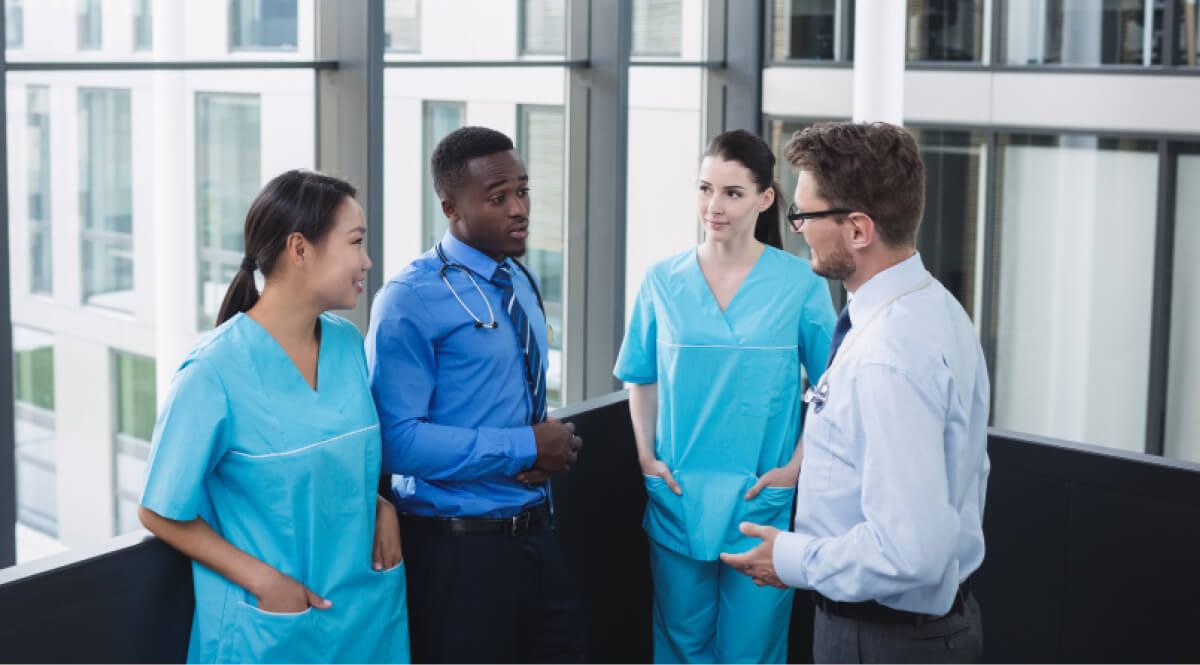 Hospital staff interacting with each other