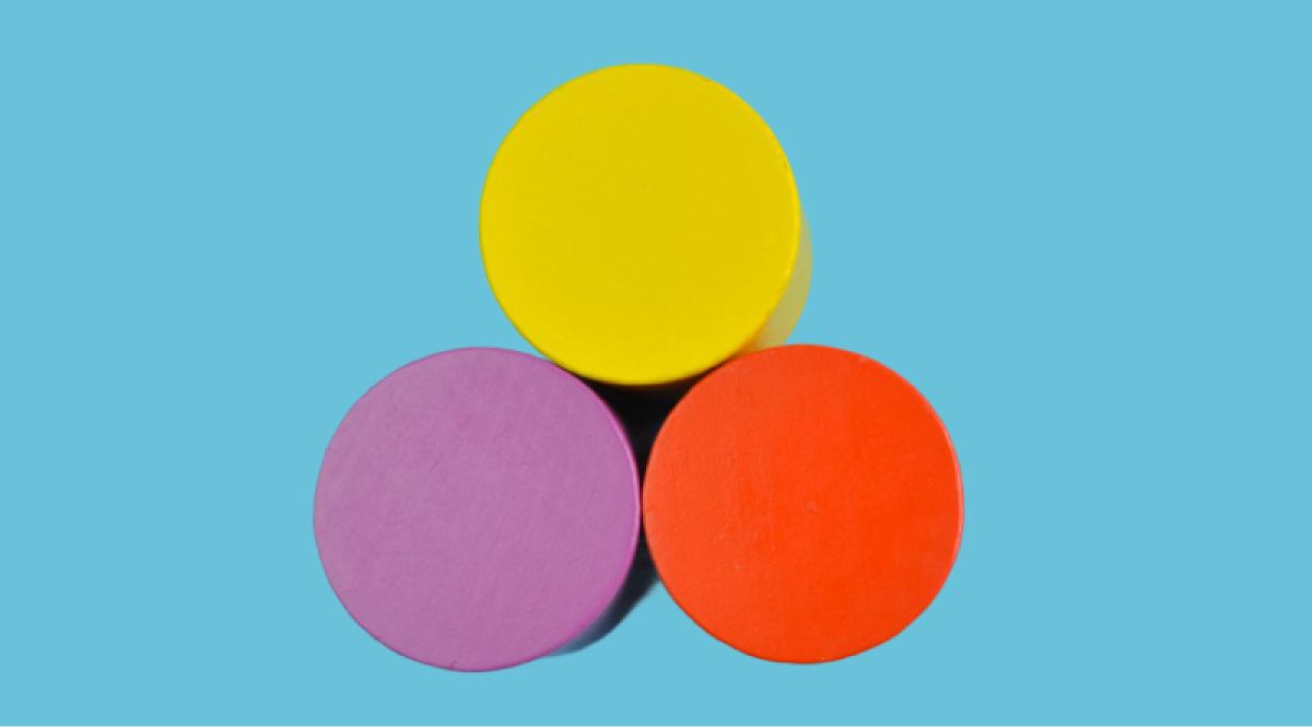 Three cylinders of pink, orange and yellow