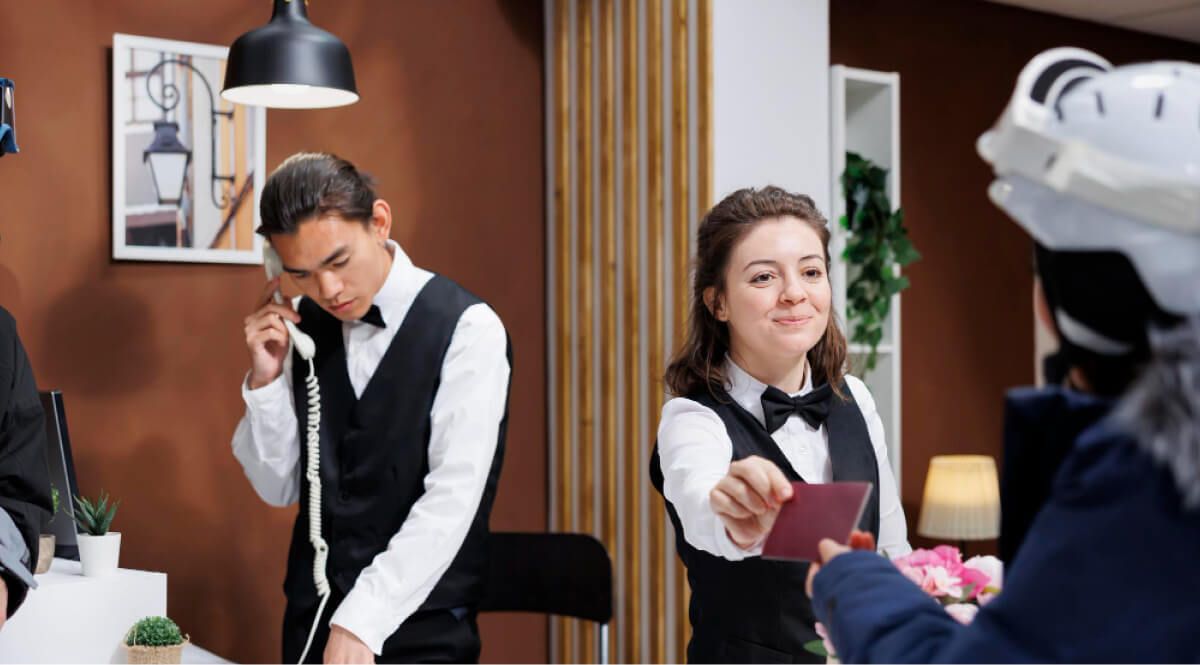 employee handing over customers passport back