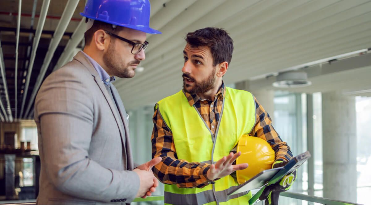 Contract worker explaining to engineer