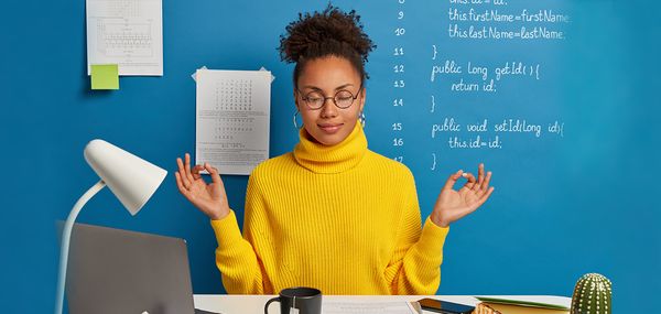 Employee meditating in the workplace