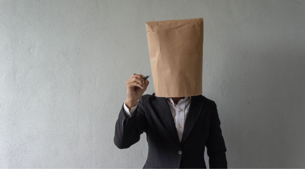 Employee with paper bag over head