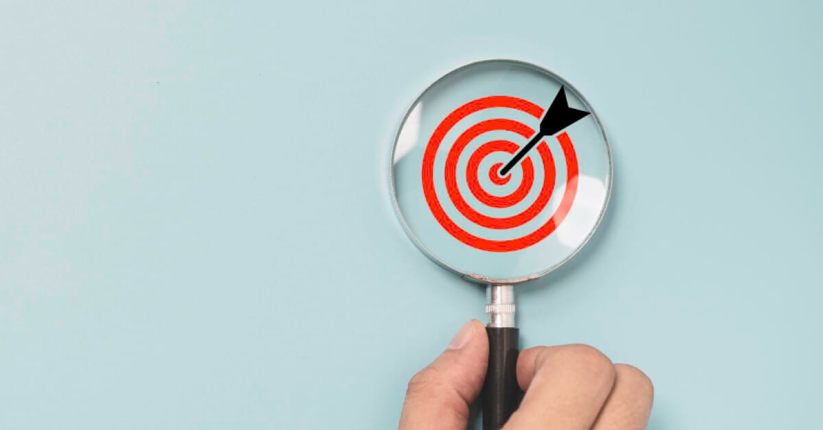 Magnifying glass over a target clipart 