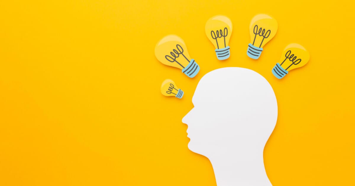 Paper design of a man and paper bulbs around him