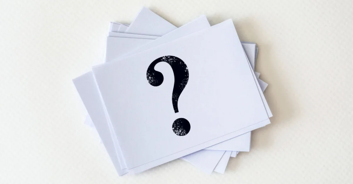 Stack of cards with question marks on them