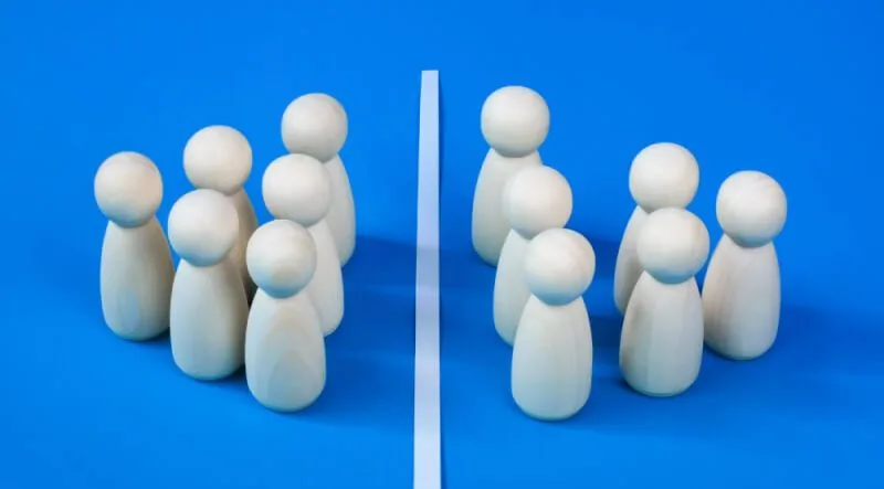 Two opposite facing white wooden pin groups aligned against each other