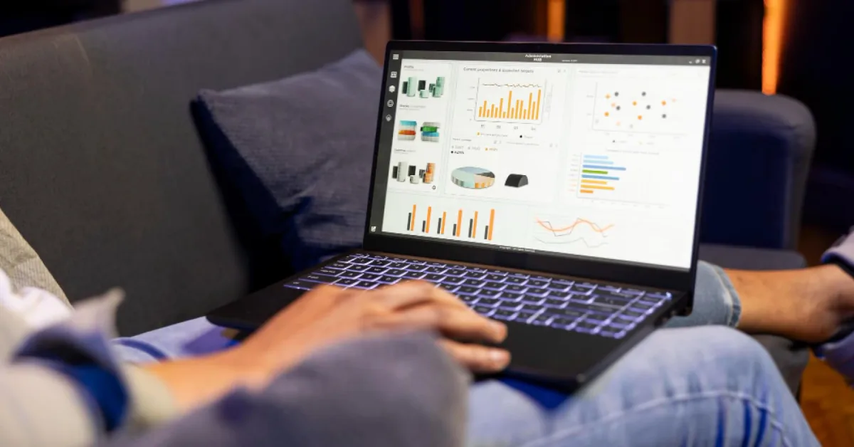 Man looking at statistics and analytics in his laptop